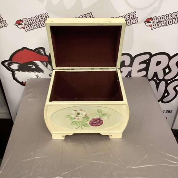 Vintage floral storage box with a hinged lid.