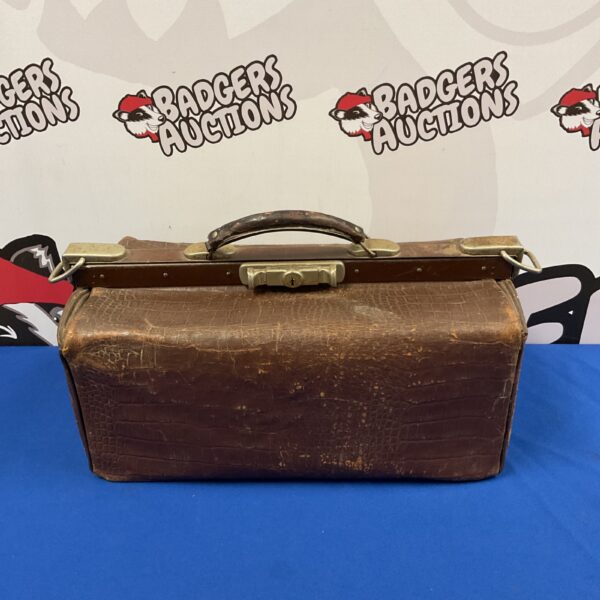 Vintage brown leather Gladstone doctors bag with locking mechanism.