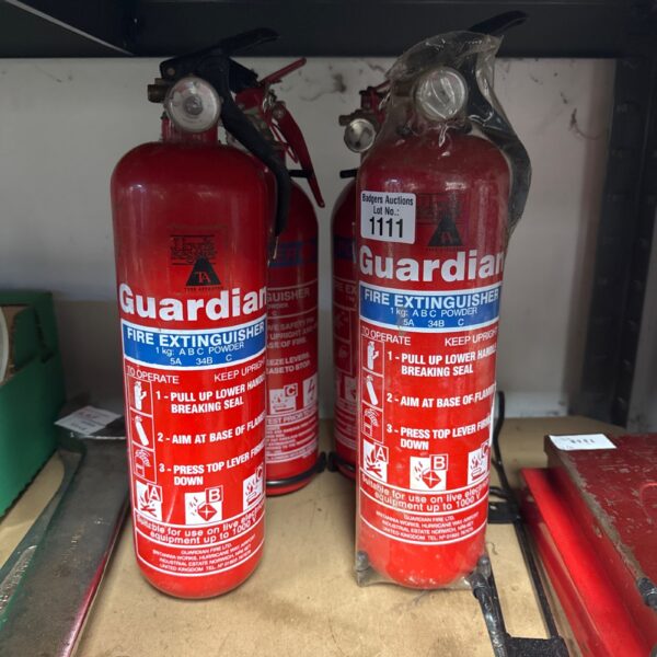 Red vintage Guardian fire extinguisher, a collectible piece of fire safety equipment.