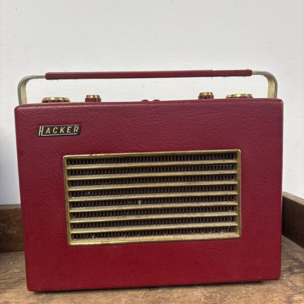 Red vintage Hacker Herald radio with telescopic aerial.