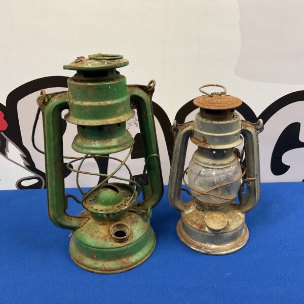 Pair of vintage hurricane lanterns with green and silver finishes.