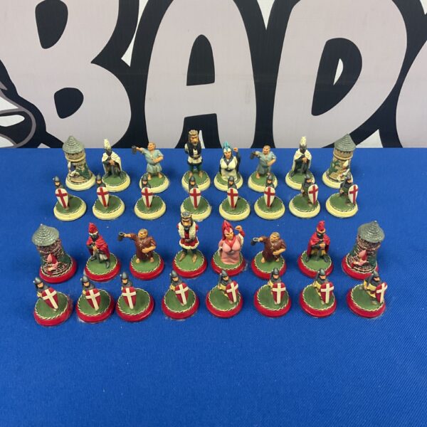 Vintage lead chess pieces set on display.