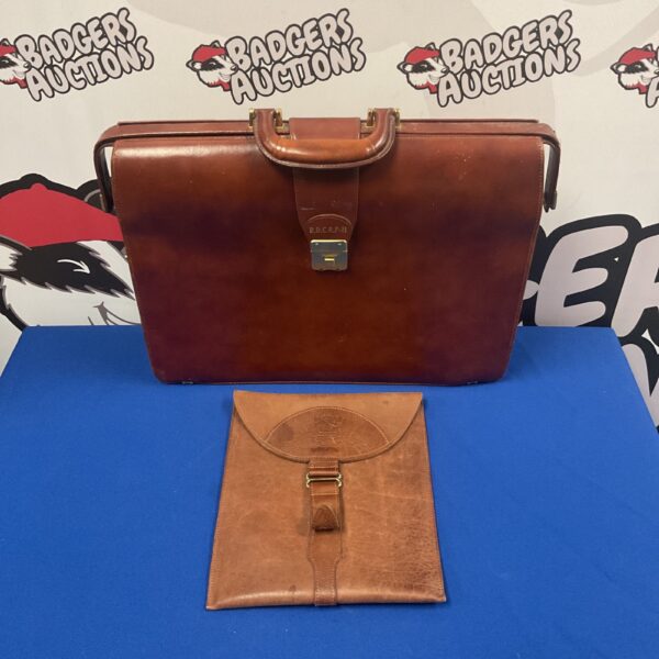 Vintage brown leather briefcase with R.D.C.R.P-H initials.