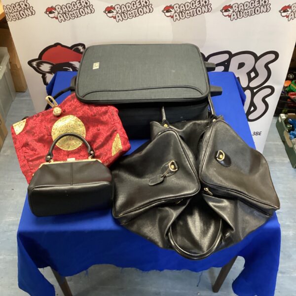 Vintage red and black patterned luggage set with suitcase and bags.
