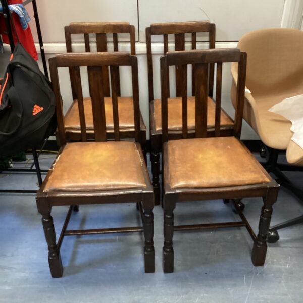 Vintage mahogany dining chair with leather seat.