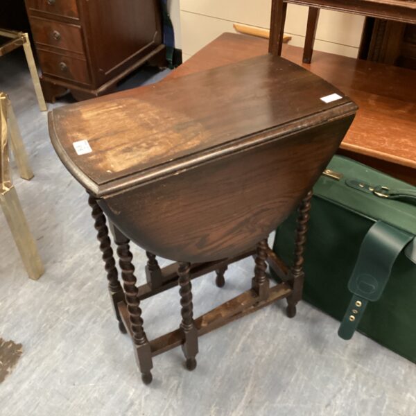 Vintage mahogany drop leaf table with barley twist legs.