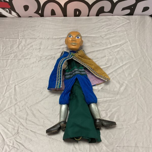 Vintage wooden marionette puppet in colourful costume.