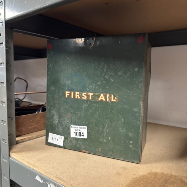 Vintage metal first aid box with classic lettering.