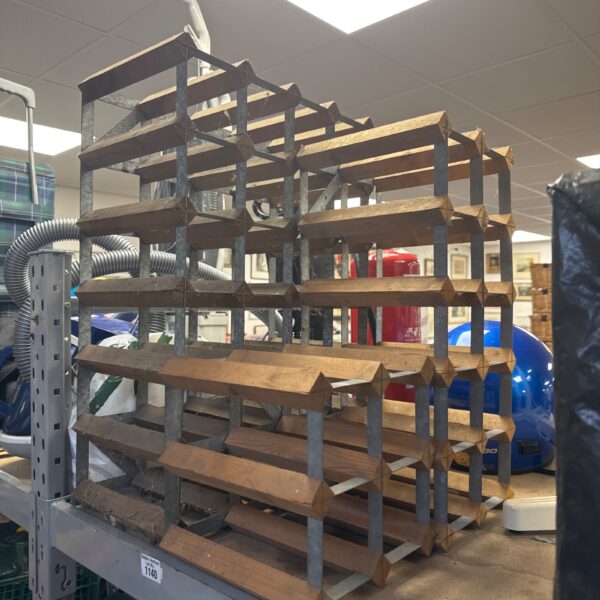 Vintage metal wine bottle rack for storage and display.