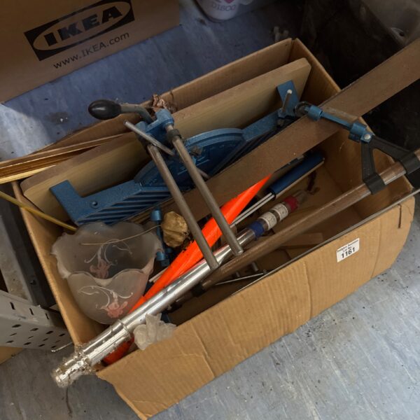 Vintage mitre saw and cycle pump in a cardboard box.
