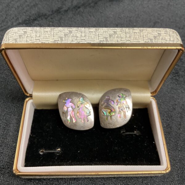 Vintage silver-tone earrings with mother of pearl inlay.