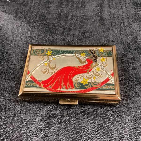 Vintage musical compact with enamel lady design.