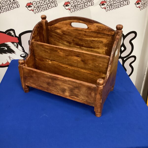 Vintage oak magazine rack for storing books and magazines.