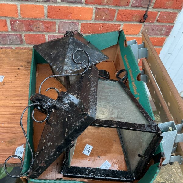 Vintage wrought iron outdoor lamp with weathered patina.