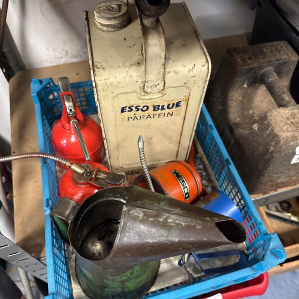 Vintage Esso paraffin and oil cans, a collectible garage lot.