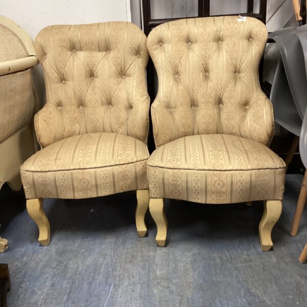Pair of vintage parlour chairs with patterned upholstery.