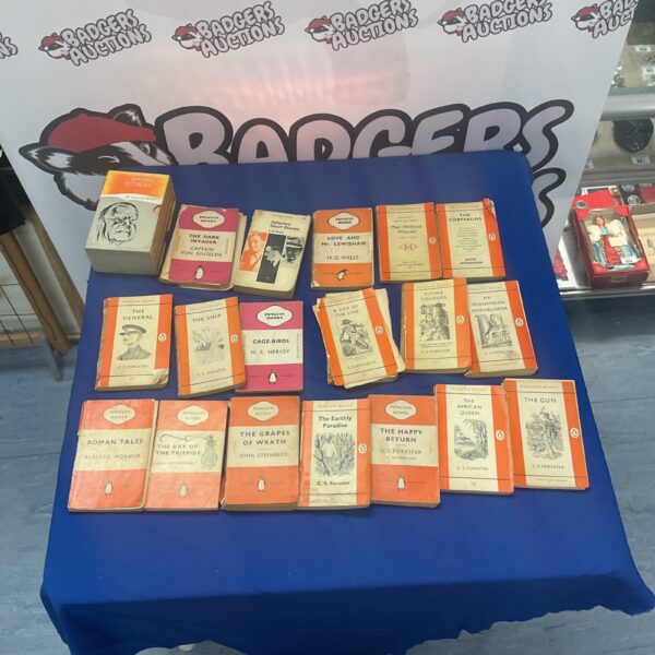 Lot of vintage Penguin Books with colourful covers.