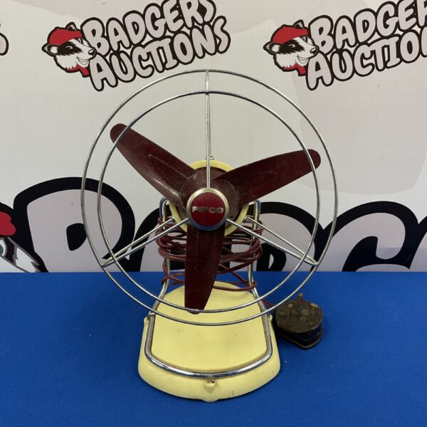 Vintage Pifco desk fan with cream body and three blades.