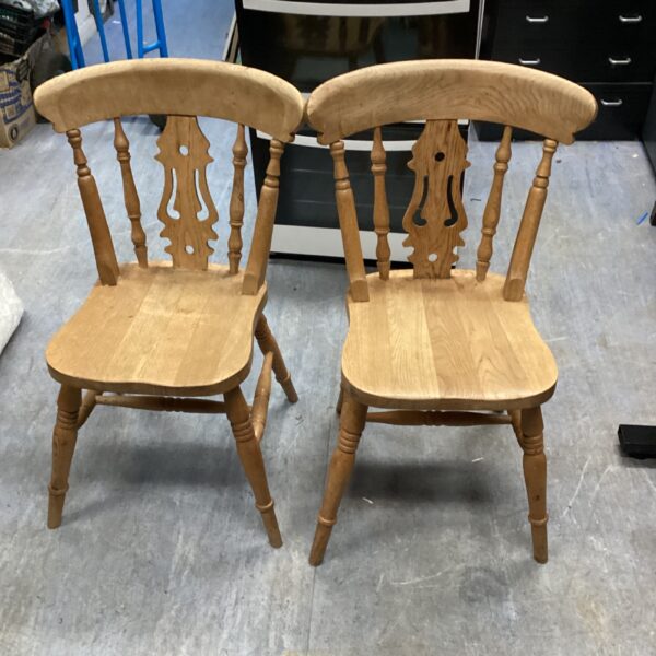 Vintage pine fiddleback chair with curved backrest.
