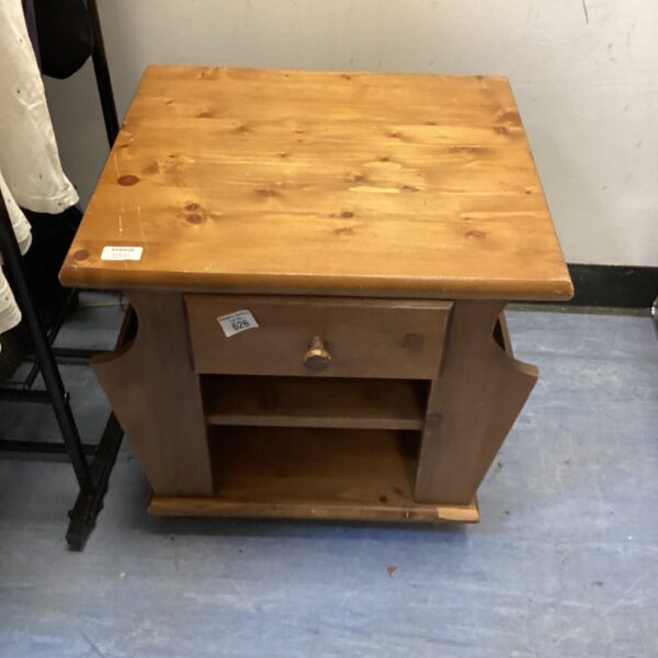 Vintage pine magazine table with drawer and open shelf.