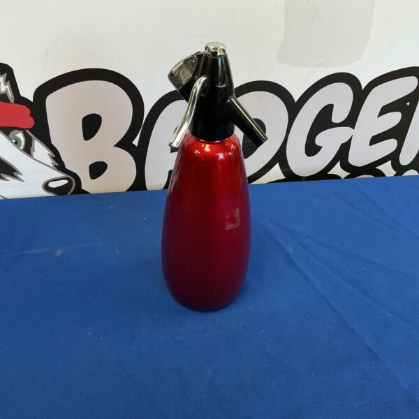 Vintage red soda syphon, classic kitchen collectible.