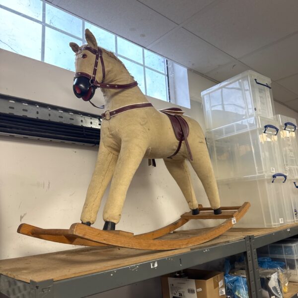 Vintage wooden rocking horse, classic children’s toy for nursery.