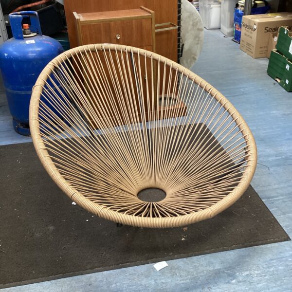 Vintage woven rope chair with a detailed seat.