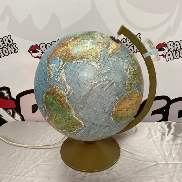 Illuminated vintage Danish Scan Globe with detailed cartography.