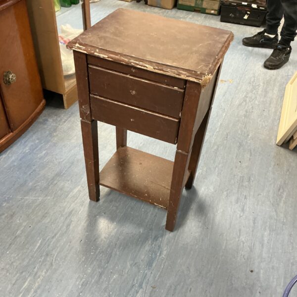 Vintage wooden side table with a single drawer and lower shelf.
