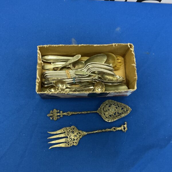 Vintage silverplate cutlery set displayed in a box.