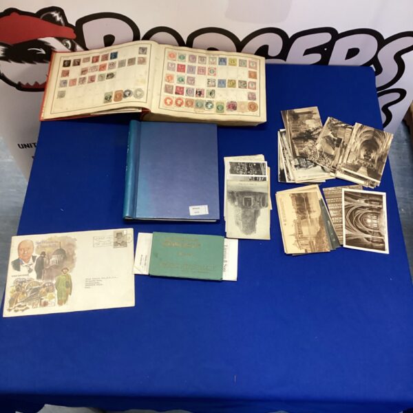 Vintage stamp albums and postcard lot for collectors.