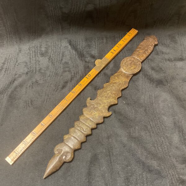 Vintage stone ceremonial dagger with sculpted handle.