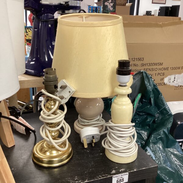 Vintage table lamp with cream shade and brass base.