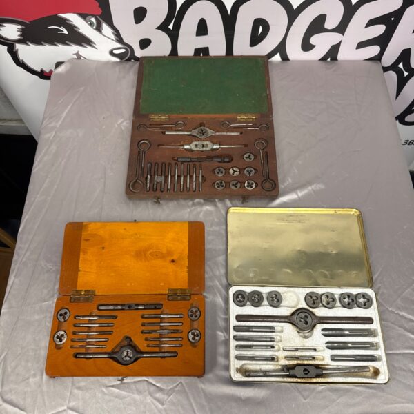 Vintage tap and die sets in wooden cases, antique metalworking tools.