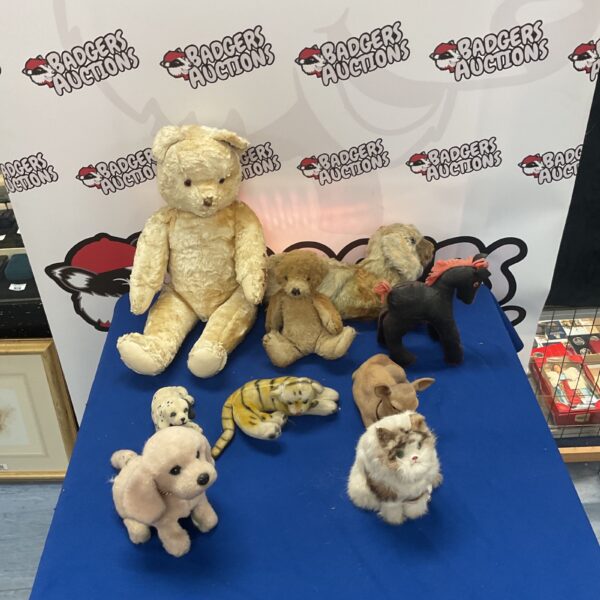 Vintage teddy bear collection with novelty animals.
