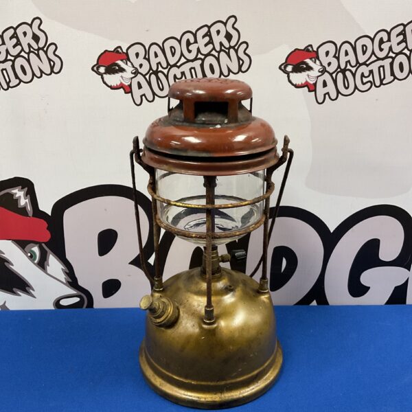 Vintage Tilley paraffin lantern with brass body and glass globe.