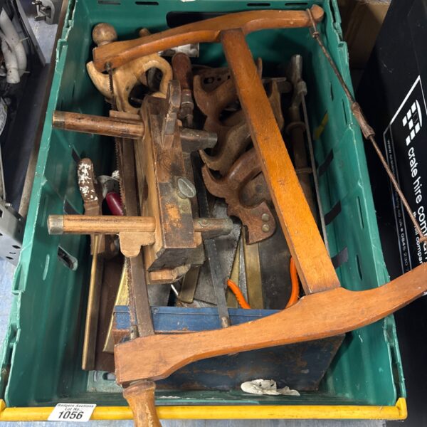 Vintage tools lot including saws and various hand implements.