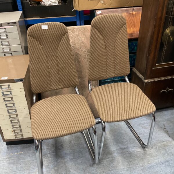 Vintage beige waiting room chairs with chrome legs.