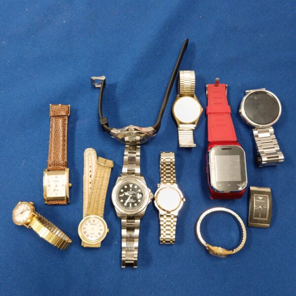 Overview of a vintage watch lot with various styles and brands.