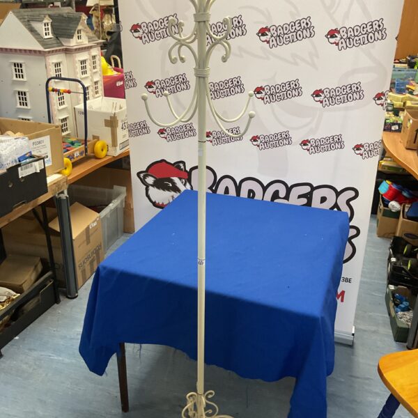 Vintage white metal coat and hat stand for entryway decor.