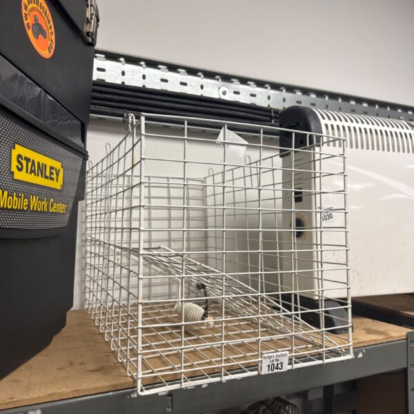 Vintage wire cage for small birds or pets.