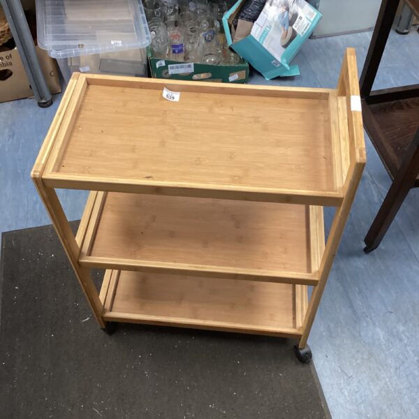 Vintage wooden hostess trolley with three tiers.
