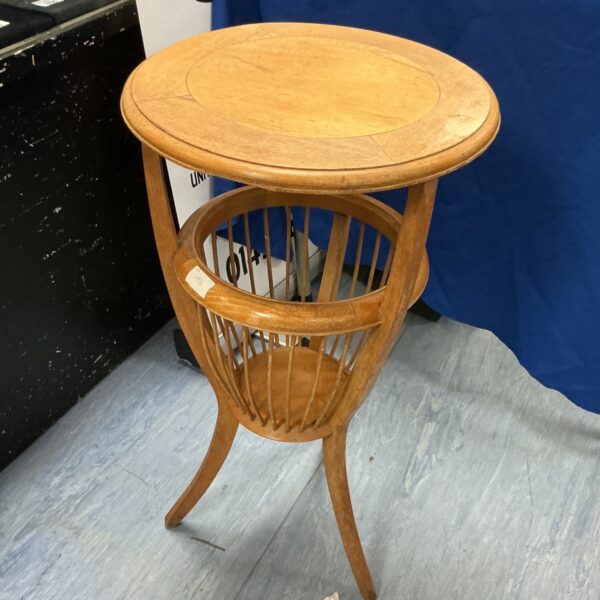 Vintage wooden jardiniere stand with curved legs and circular top.