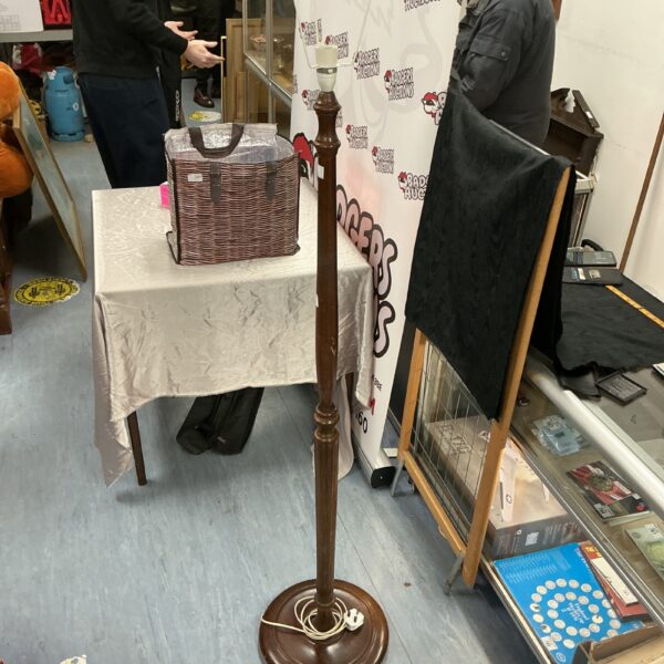 Vintage wooden lamp stand with a dark finish.