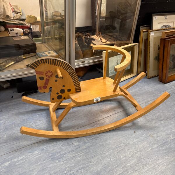 Vintage wooden rocking horse, a classic antique toy.