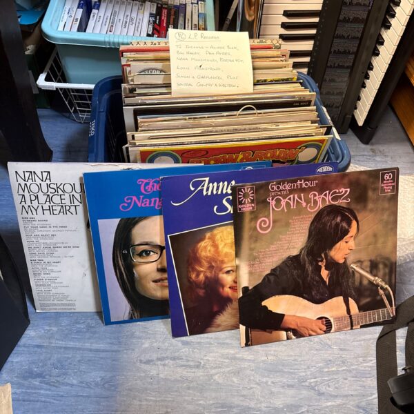 Vintage vinyl LP collection featuring Nana Mouskouri and country western records.
