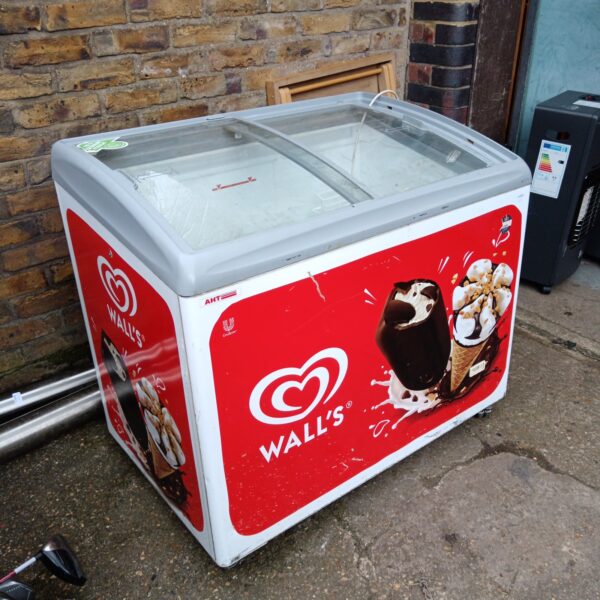 Front view of a vintage Walls ice cream freezer with branding.