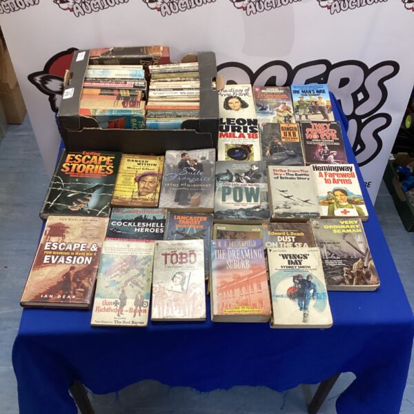 Large collection of vintage war novels and paperback books.