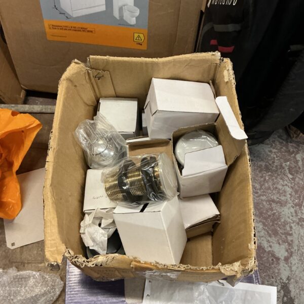 Box of new washbasin waste units for bathroom plumbing.