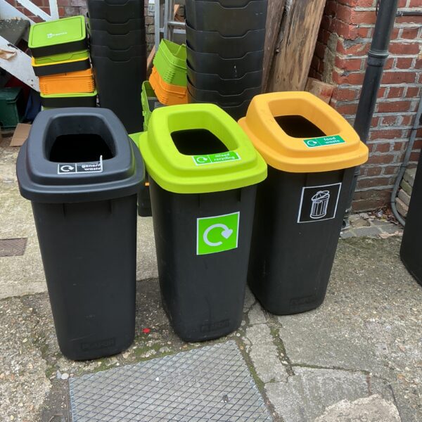 Three colourful waste bins for garden or outdoor use.